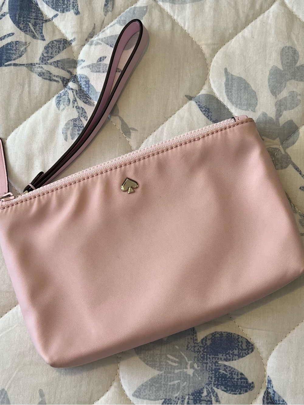 kate spade light pink wristlet clutch with gold spade logo